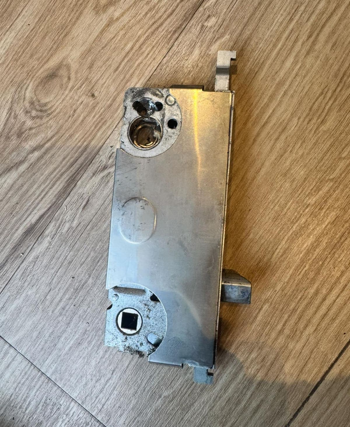 A worn gearbox taken out of a multipoint door lock
